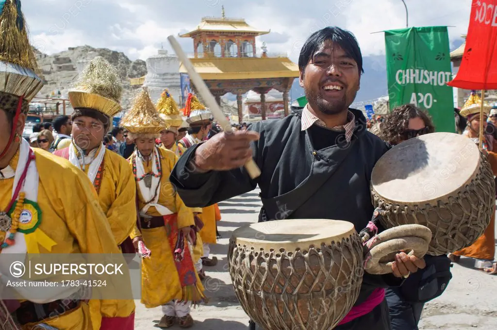 Musician playing Daman (drums) during the opening parade of the Festival of Ladakh. The Festival Ladakh is held every year in the first two weeks of S...