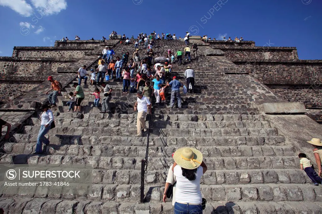 near Mexico city; Mexico, Teotihuacan archeological site, People climbing up Pyramid of the Moon