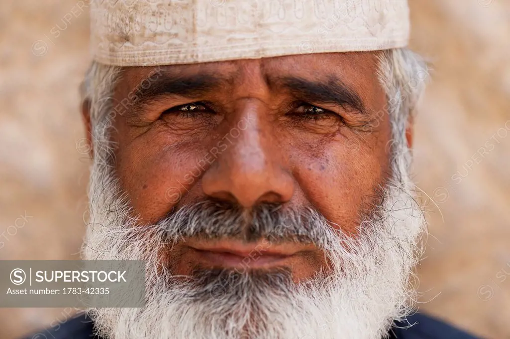 Portrait of bearded man in traditional cap; Al Ain, Abu Dhabi, United Arab Emirates