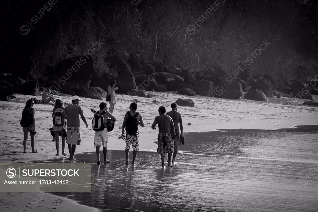 Walking on beach in Praia da Conceicao, Unesco World Heritage Site; Praia da Cachorro, Fernando de Noronha, Pernambuco, Brazil