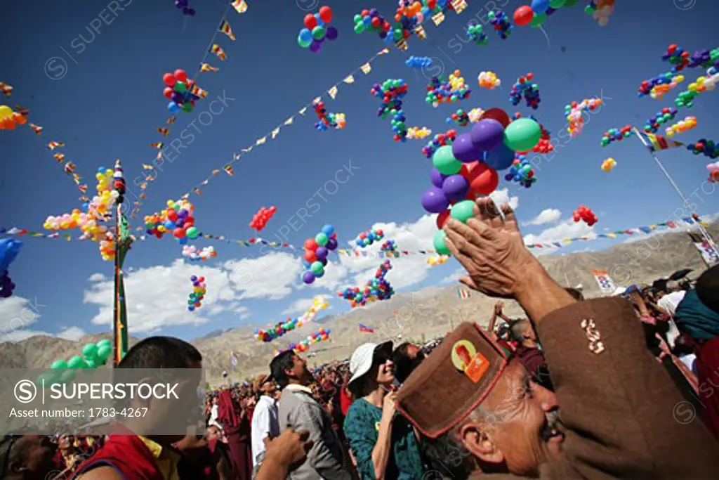 Monks with thousands of multi colored balloons at 800 year old birthday celebration / rituals of the Buddhist Drukpa Lineage, Naro Photang Shey, ( Shey Monastery ), Leh Ladakh, Indian Himalayas, India, Monks with thousands of multi coloured balloons at 800 year old birthday celebration / rituals of 
