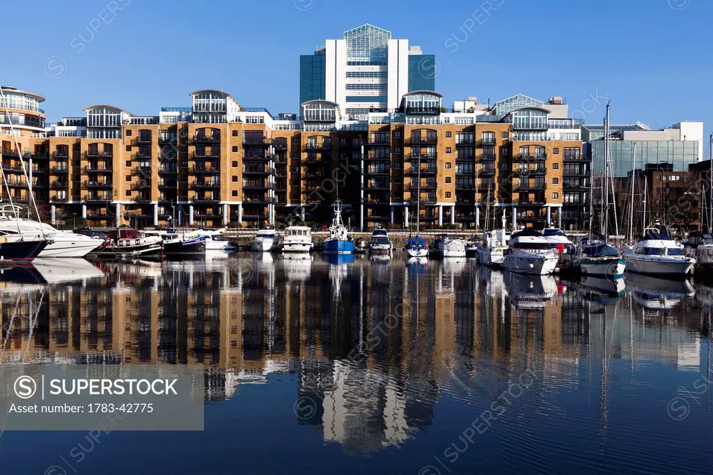 Boats moored in up-market marina at St Katharine's Dock; London, England, UK
