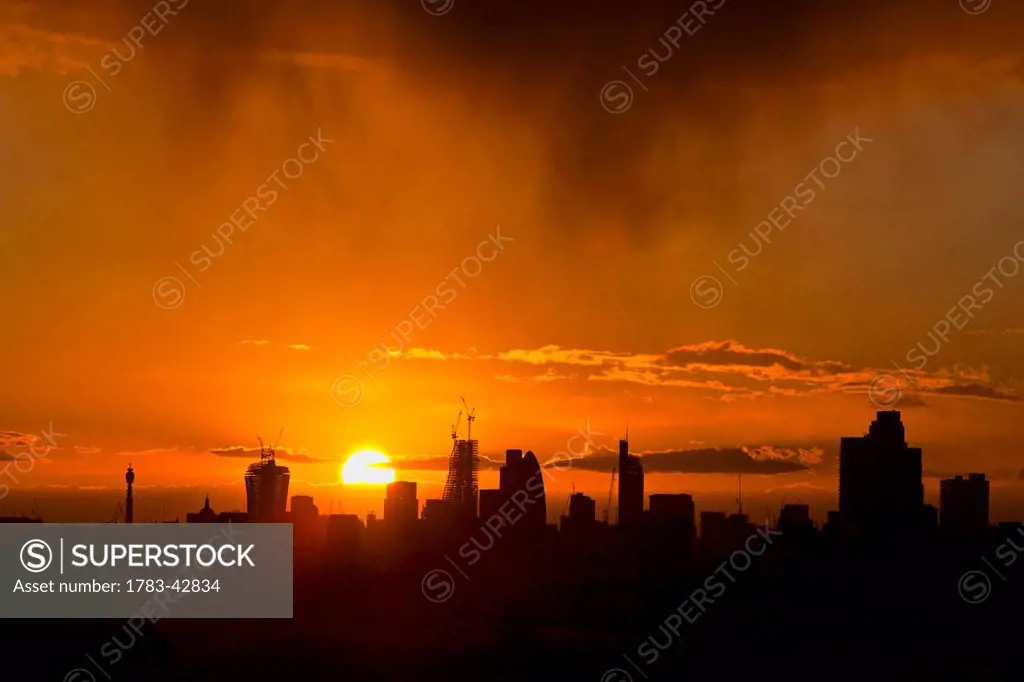 City of London Skyline with setting sun; London, England, UK