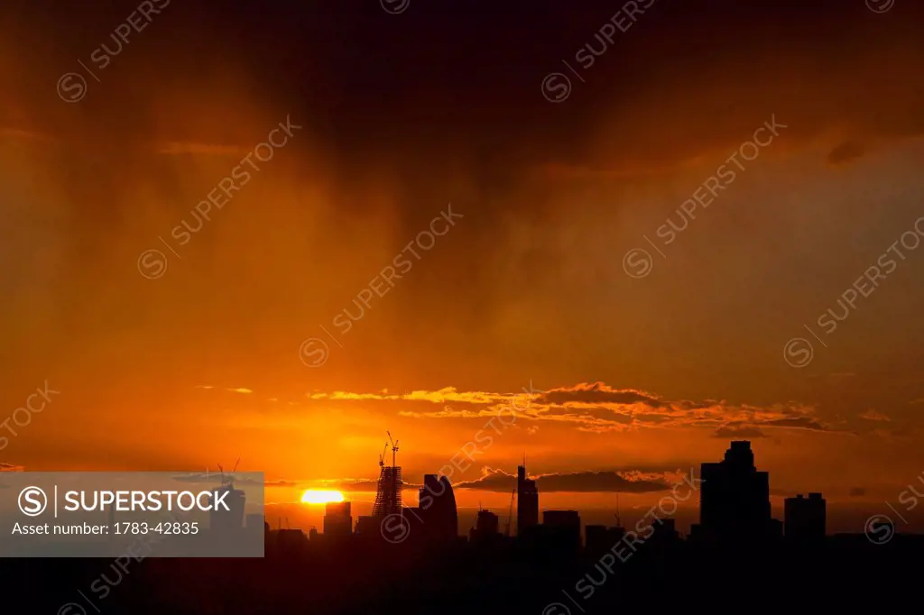 City of London Skyline with setting sun; London, England, UK