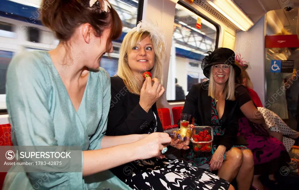 On train for Royal Ascot and Lady's Day; England, UK
