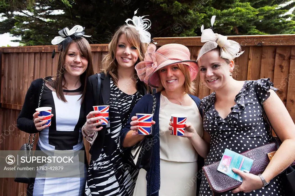 Group portrait of women at Royal Ascot for Lady's Day; London, England, UK
