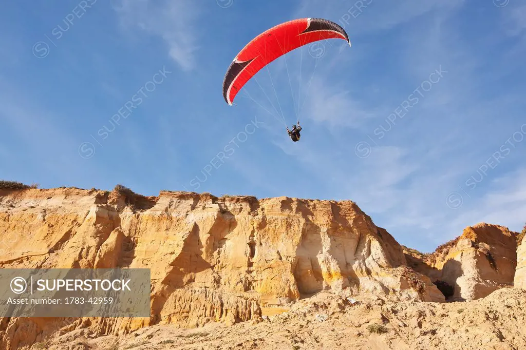 Paraglider above coast in Donana Nature Park; Seville, Andalucia, Spain
