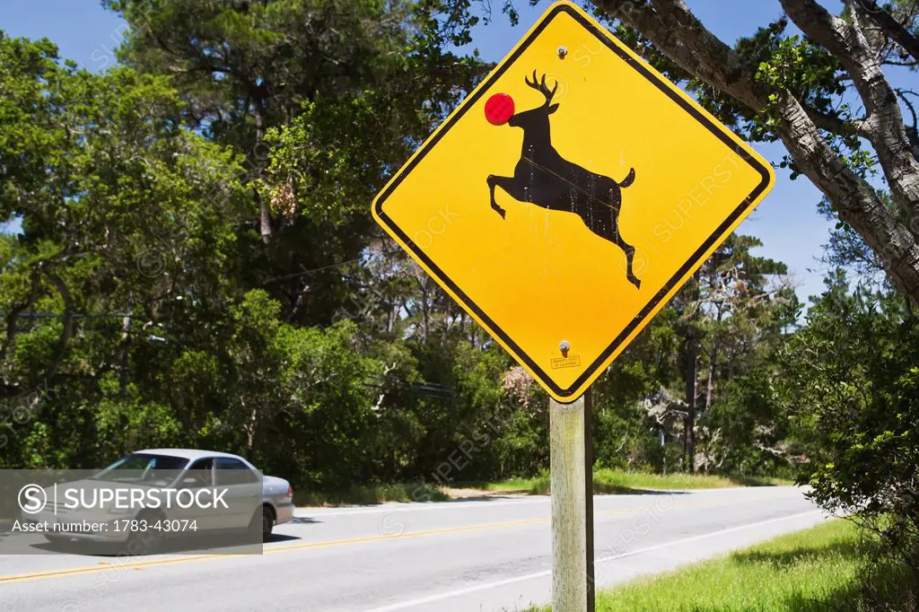 Deer crossing sign with red nose; California, USA