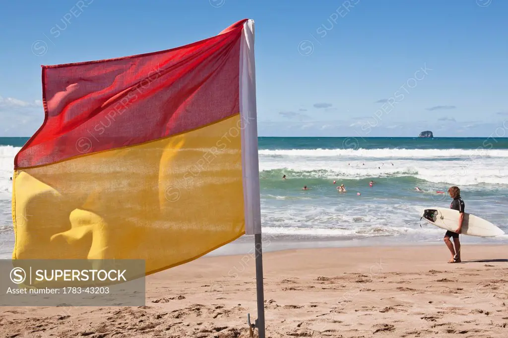 Surf lifesaving flag on beach; New Zealand