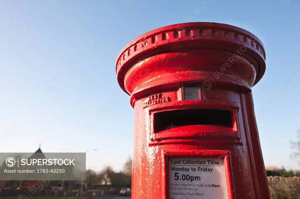 Red public mailbox; Glastonbury, Somerset, England, UK
