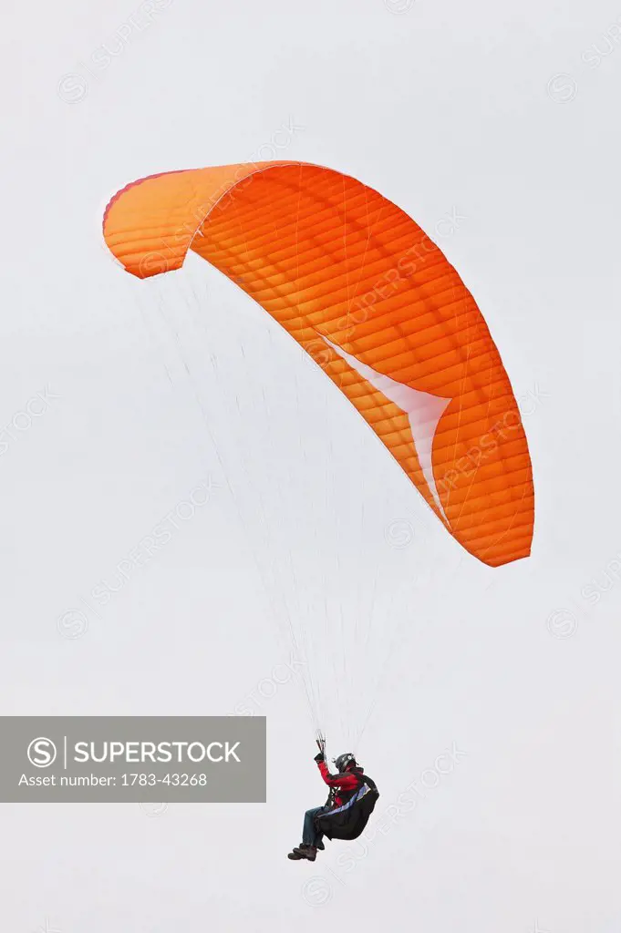 Paragliding above Newgale Beach along Pembrokeshire Coast Path near St David's; Wales, UK