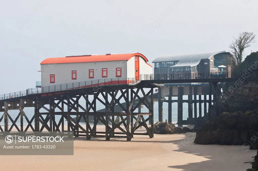 Old lifeboat station with new one in background; Tenby, Pembrokeshire Coast Path, Wales, United Kingdom