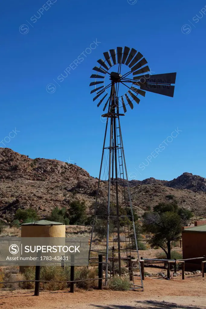 Windmill with fence; Namibia