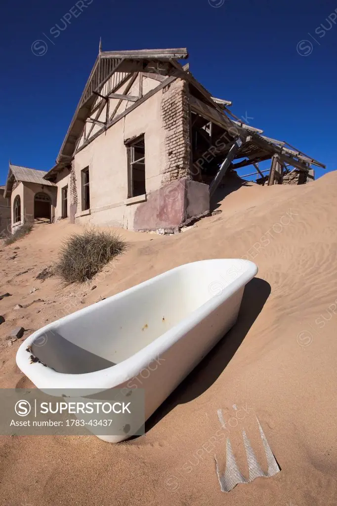 Bathtub in abandoned town; Kolmanskop Ghost Town, Namibia