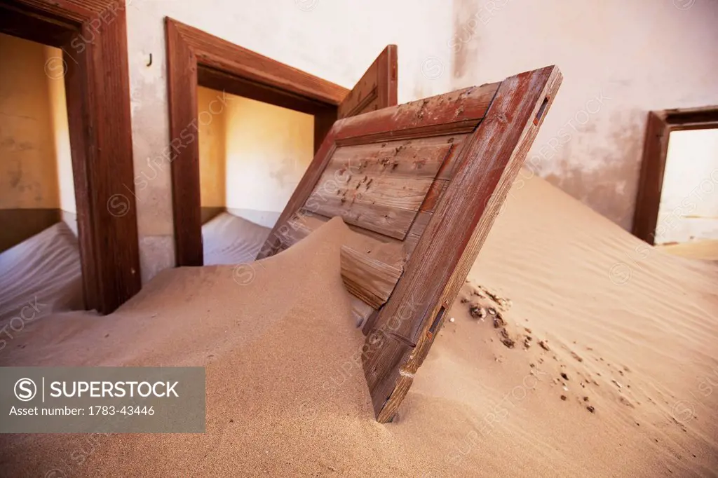 Door in sand dune; Kolmanskop Ghost Town, Namibia
