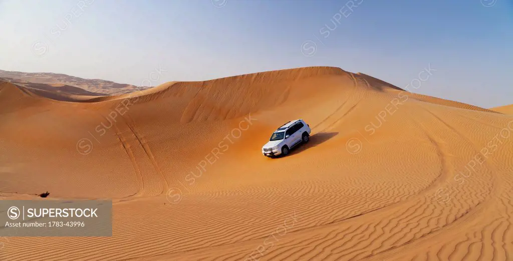 Four wheel driving in the desert; Liwa Oasis, Abu Dhabi, United Arab Emirates