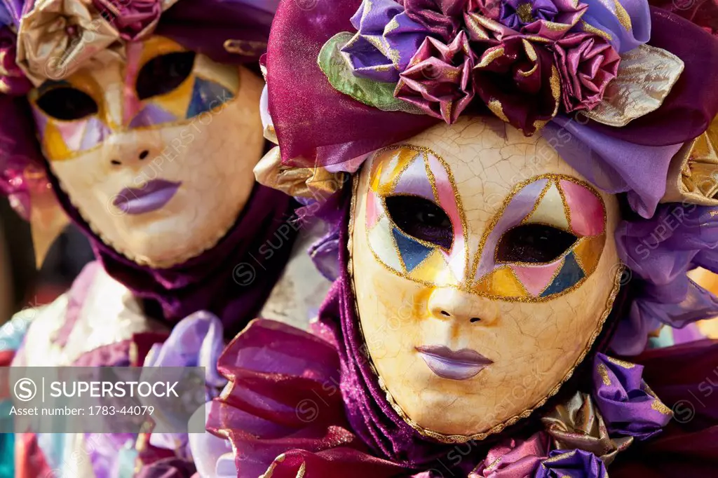 People in Venetian costumes during Venice Carnival; Venice, Italy