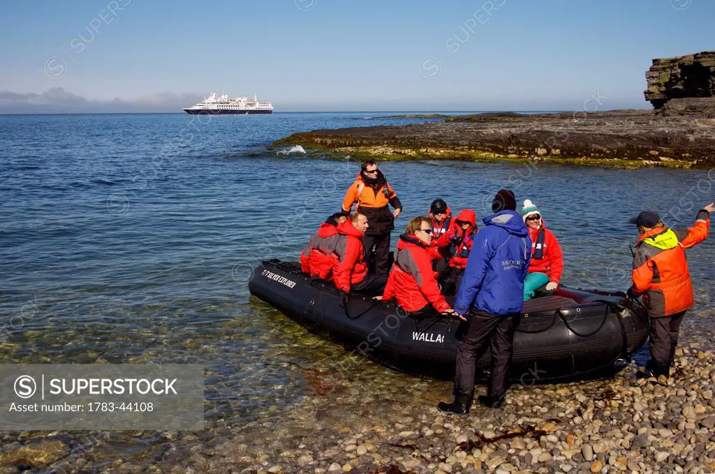 A group of tourists in an inflatable raft; Svalbard, Norway