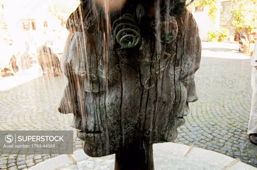 Sculpture of a head with two faces; Bernkastel-Kues, Rhineland-Palatinate, Germany