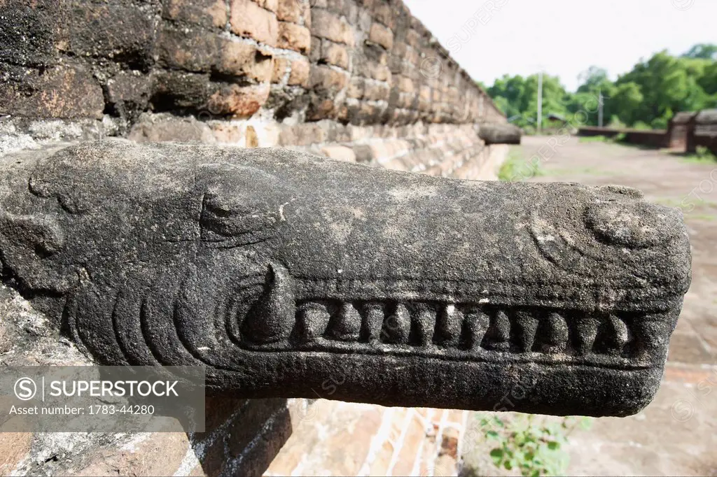 Crocodile-like mythical creature carving at the unfinished Mingun Pagoda that was destroyed by an earthquake; Mandalay, Burma