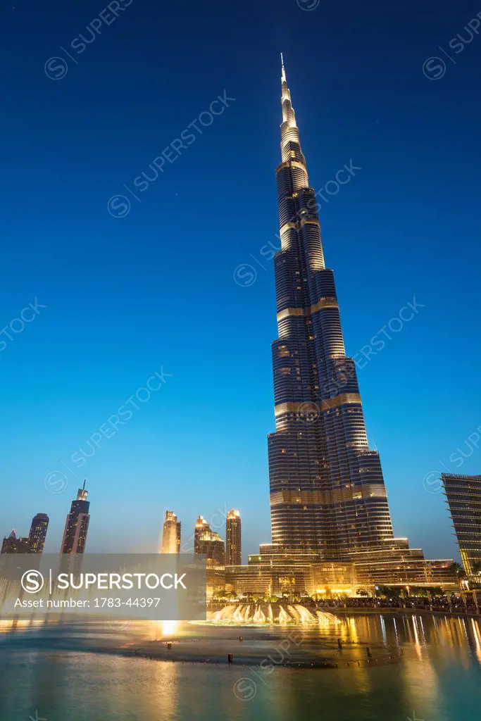 Fountain display in front of the Burj Khalifa at sunset; Dubai, United Arab Emirates