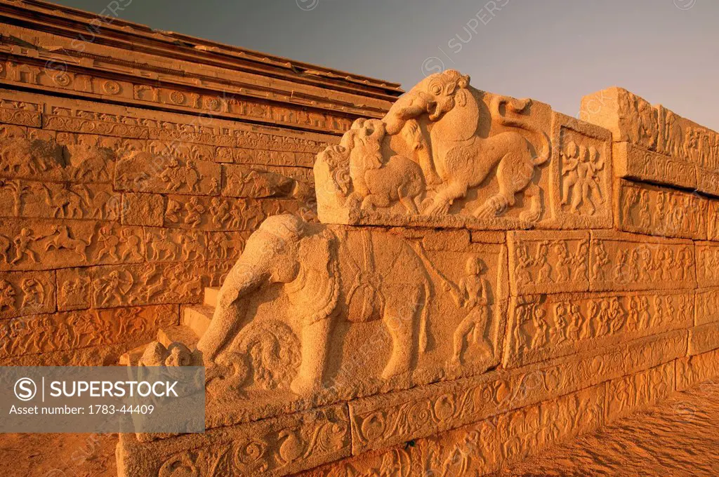 Animal figures carved into an ornate wall; Hampi, Karnataka, India