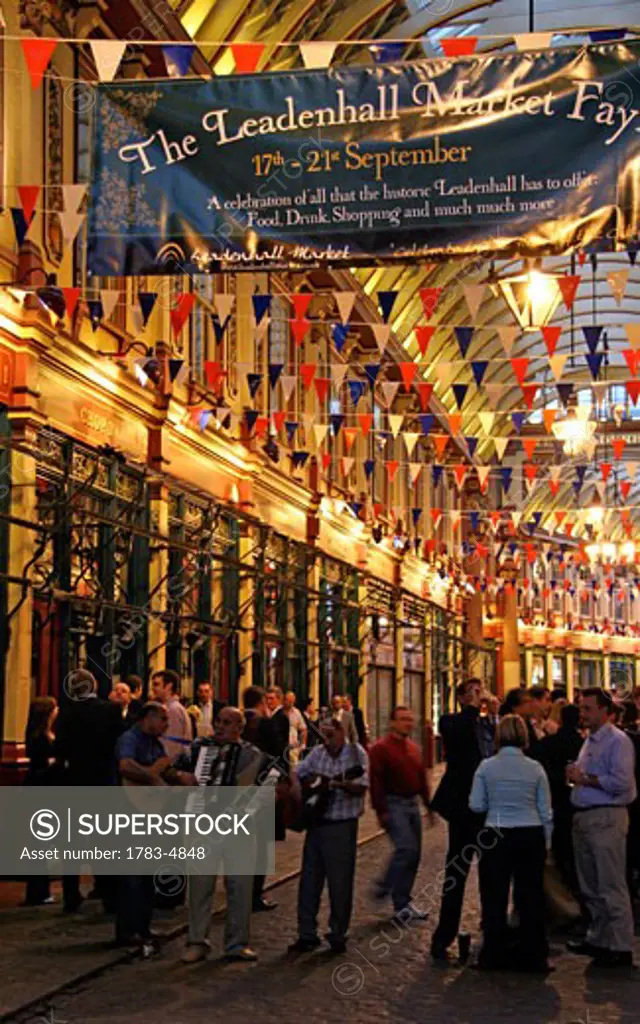 People enjoying the Leadenhall Market Fair, London, England, UK