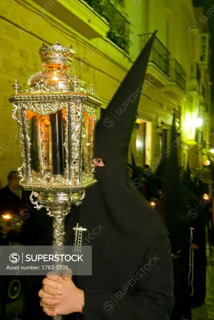 Procession of masked hooded priests at Semana Santa Easter festival, Cadiz,Andalucia,Spain