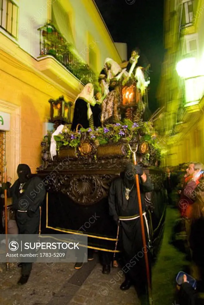 Procession of people carrying 'flota' at Semana Santa Easter festival, Cadiz,Andalucia,Spain