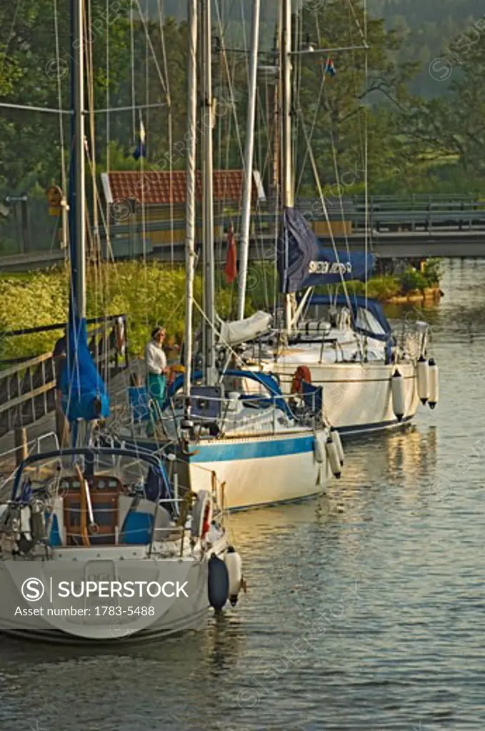 Sailboats moored along Gota Canal, Sweden