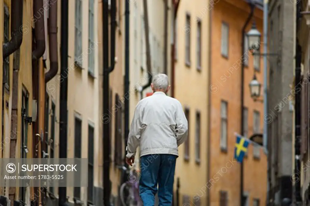 Man walking in old town,rear view, Stockholm,Sweden