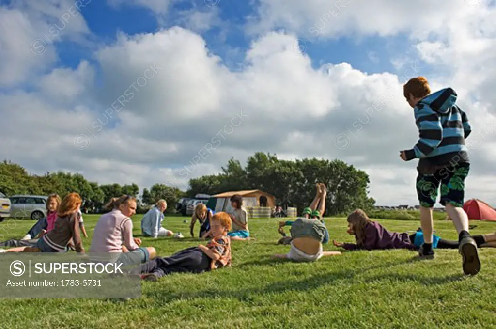 Children having fun on a camping holiday , Pevensey Bay, East Sussex, England, United Kingdom