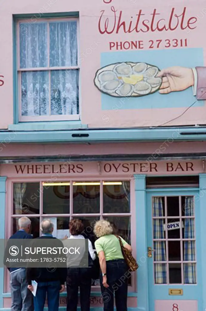 People looking into Wheeler's Oyster Bar in Whitstable , Kent, England, United Kingdom
