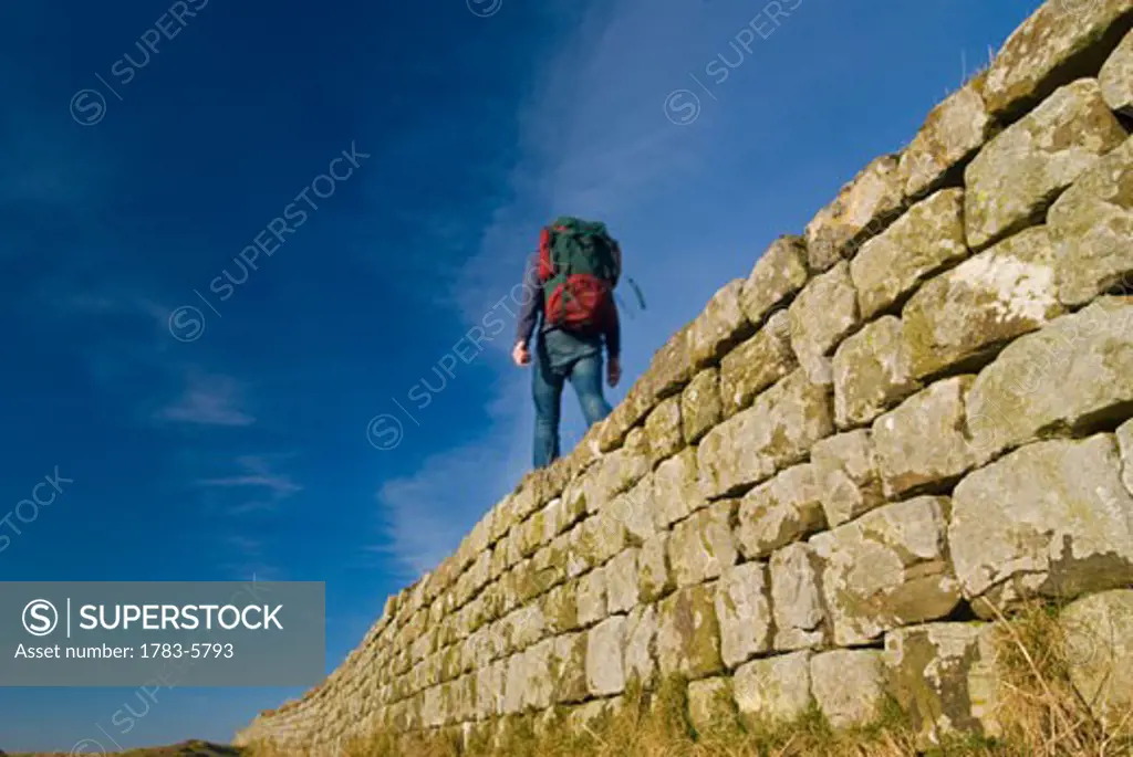 Hiker on Hadrian's Wall near Housesteads, Northumerland,England,UK