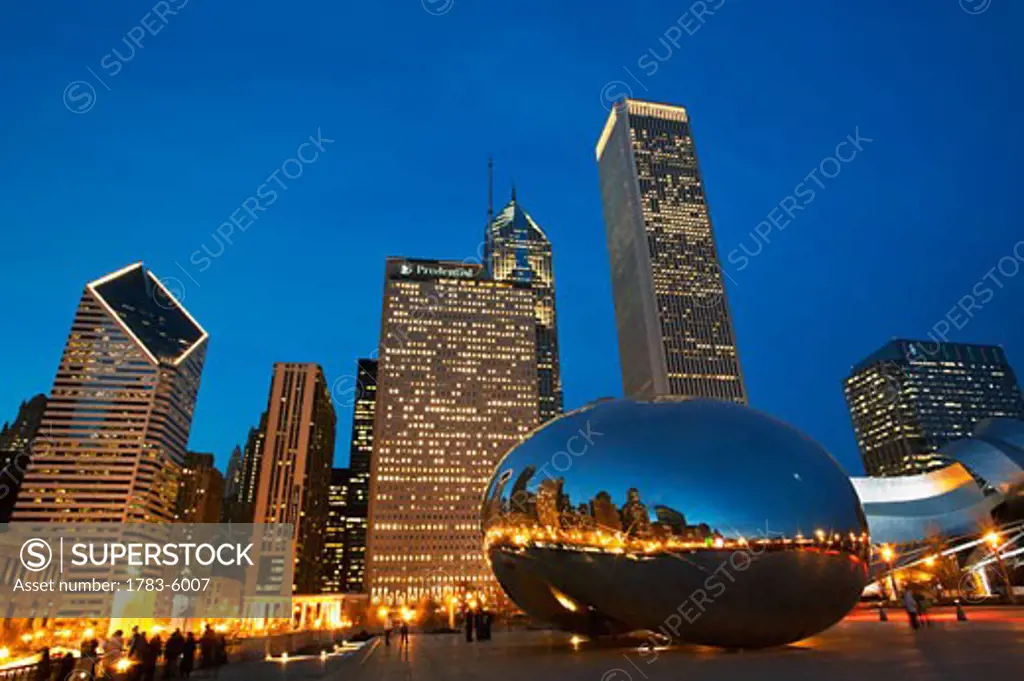 Cloud Gate (The Bean) sculpture in front of skyscrapers at night, Chicago,Illinois,USA
