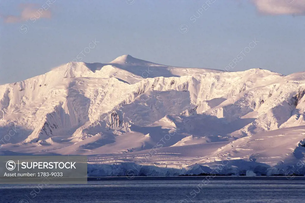 Mountains covered in snow by the coast, Melchior Islands, Antarctic Peninsula, Antarctica