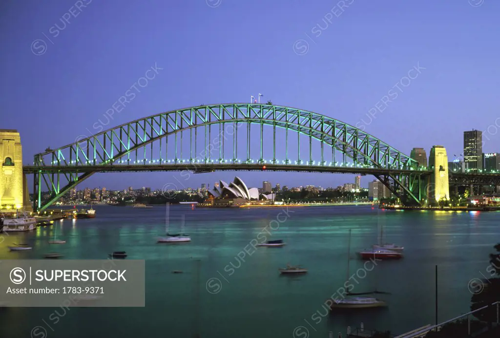 Sydney Harbour Bridge at dusk with Opera House behind, Sydney, Australia