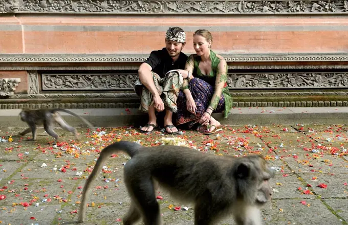Tourist couple at Monkey temple; Bali, Indonesia