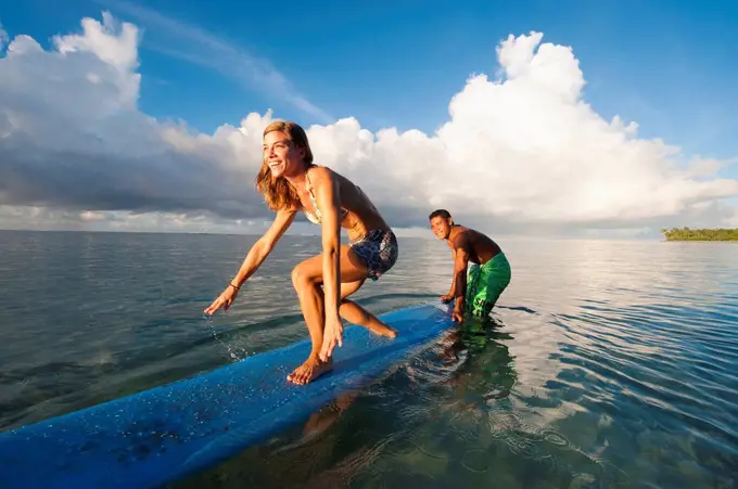 Tourist learning to surf; Samoa