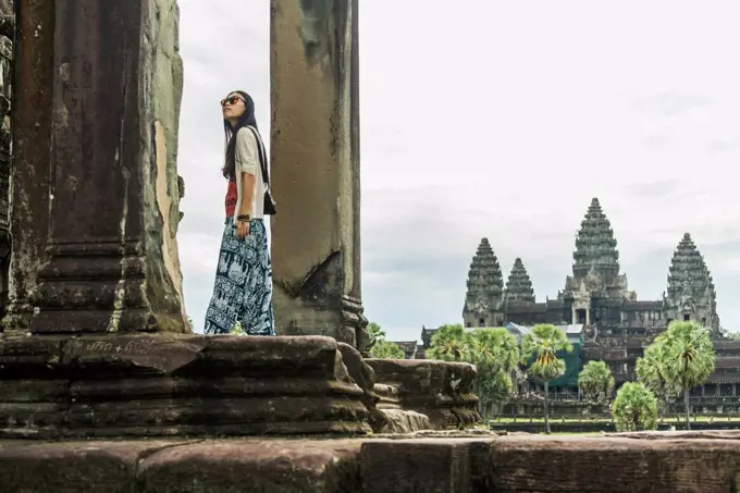 Female tourist at Angkor Wat, City of Temples; Siem Reap, Cambodia