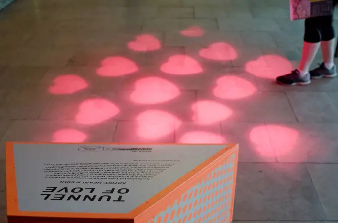 Tunnel of Love Exhibition, pink hearts projected on the floor; London, England
