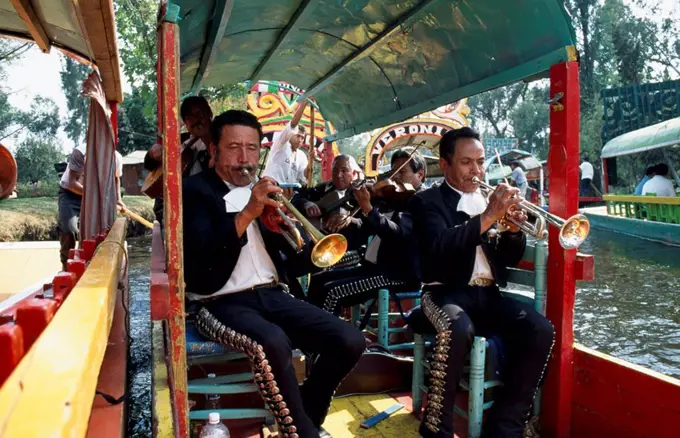 Mariachi band on colourful punts, Xochimilco, Mexico