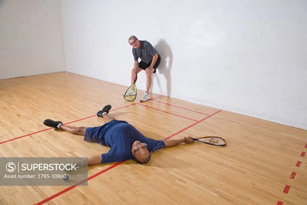 Senior men playing racketball, having fun