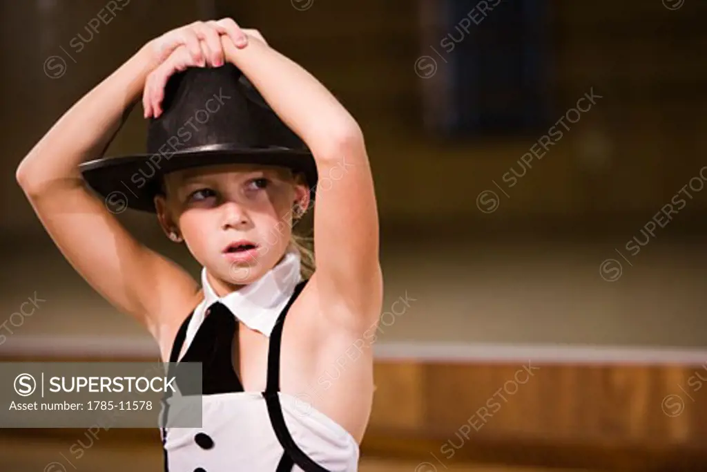 Girl in costume posing in dance studio