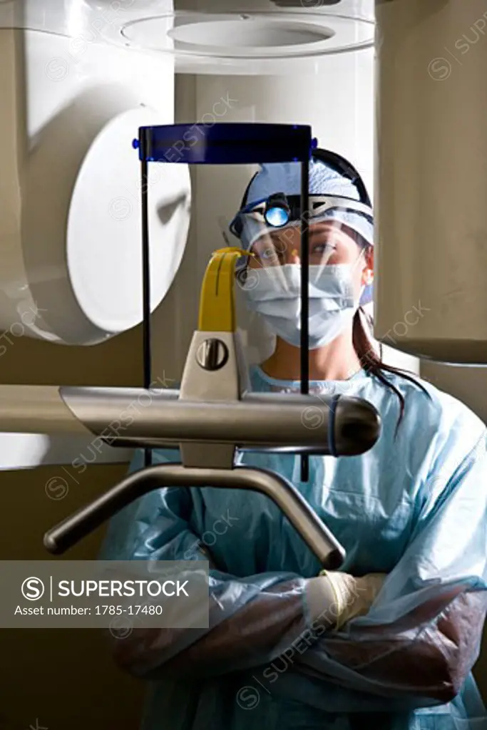 Technician with dental x-ray machine