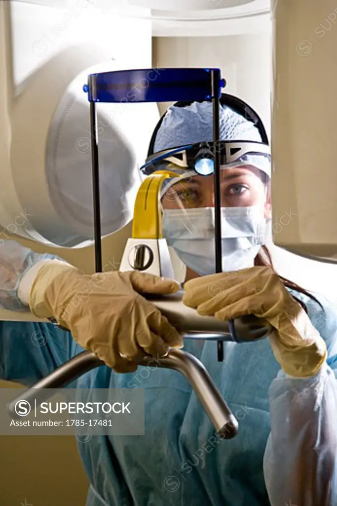 Technician with dental x-ray machine