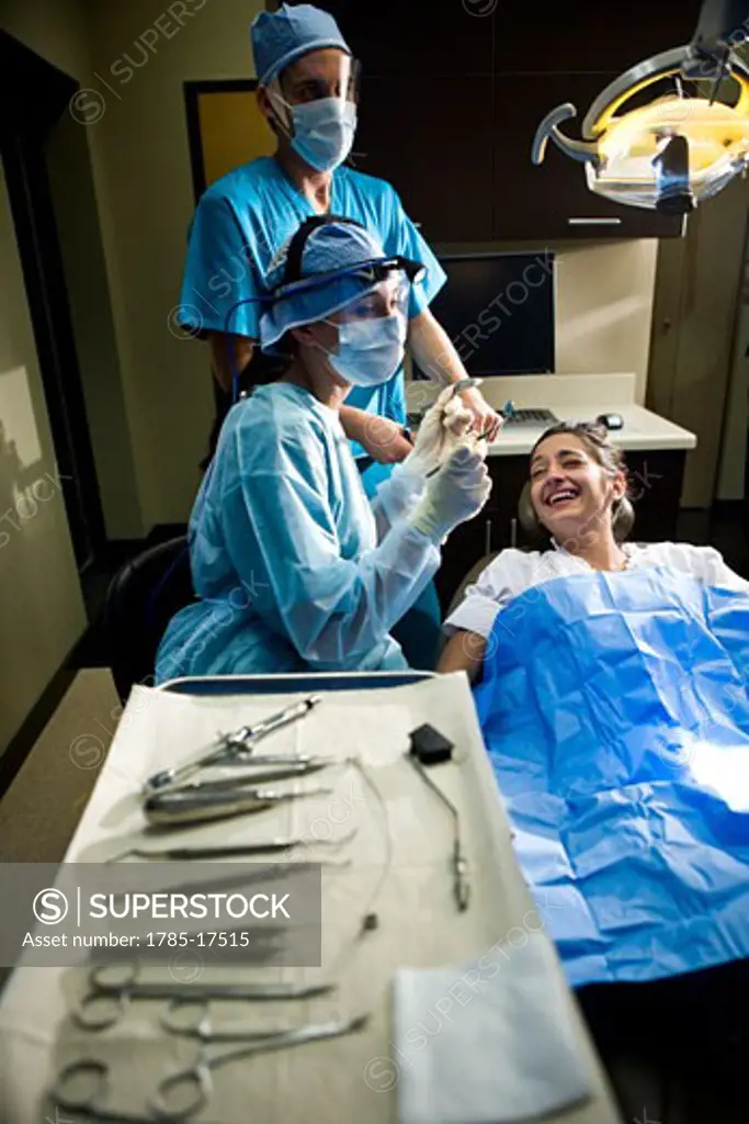 Portrait of dentist and assistants working on patient