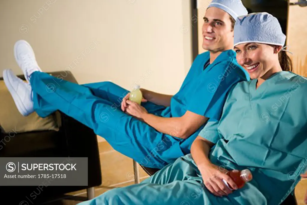 Young doctors in scrubs taking a break