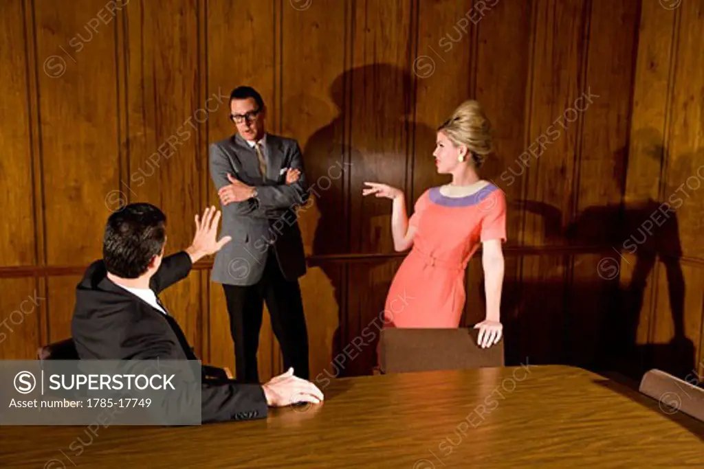 Vintage portrait of businessmen and business woman in boardroom