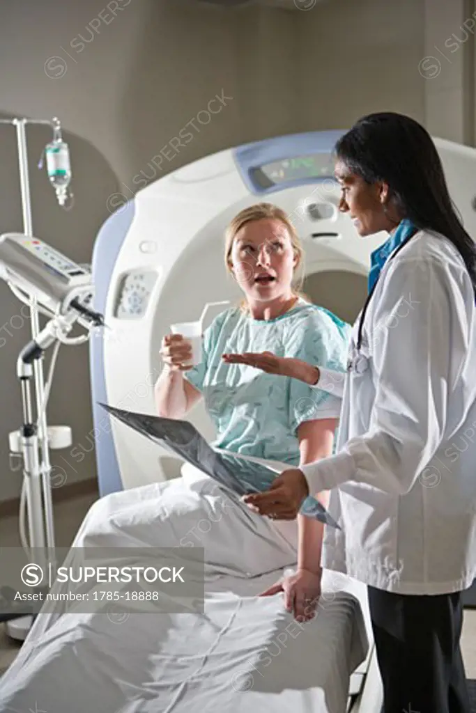 Doctor reviewing CT scan results with patient